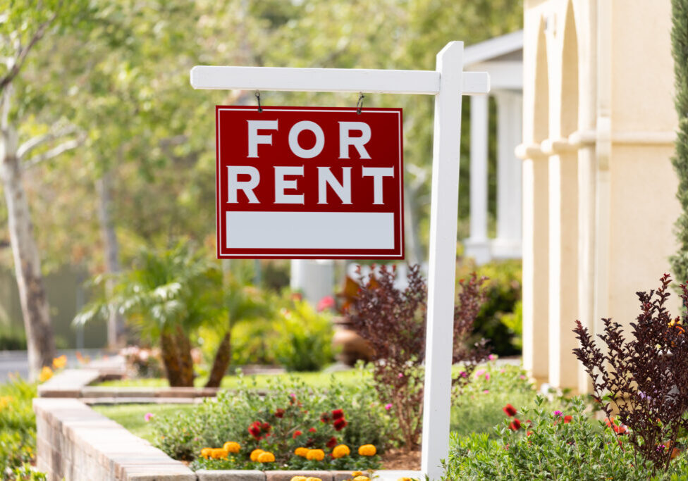 Red For Rent Real Estate Sign In Front House