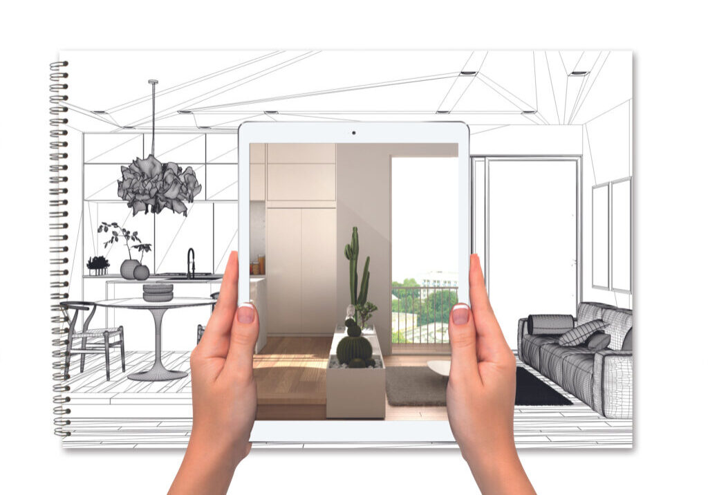 Hands Holding Tablet Showing Kitchen, Notebook With Blueprint Sketch In The Background, Augmented Reality Concept, Application To Simulate Furniture And Interior Design Products