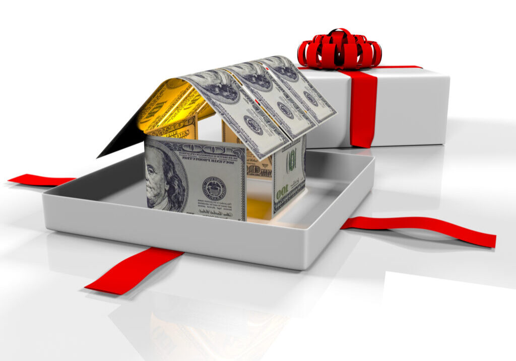 Gift Box In The House Of Banknotes On A White